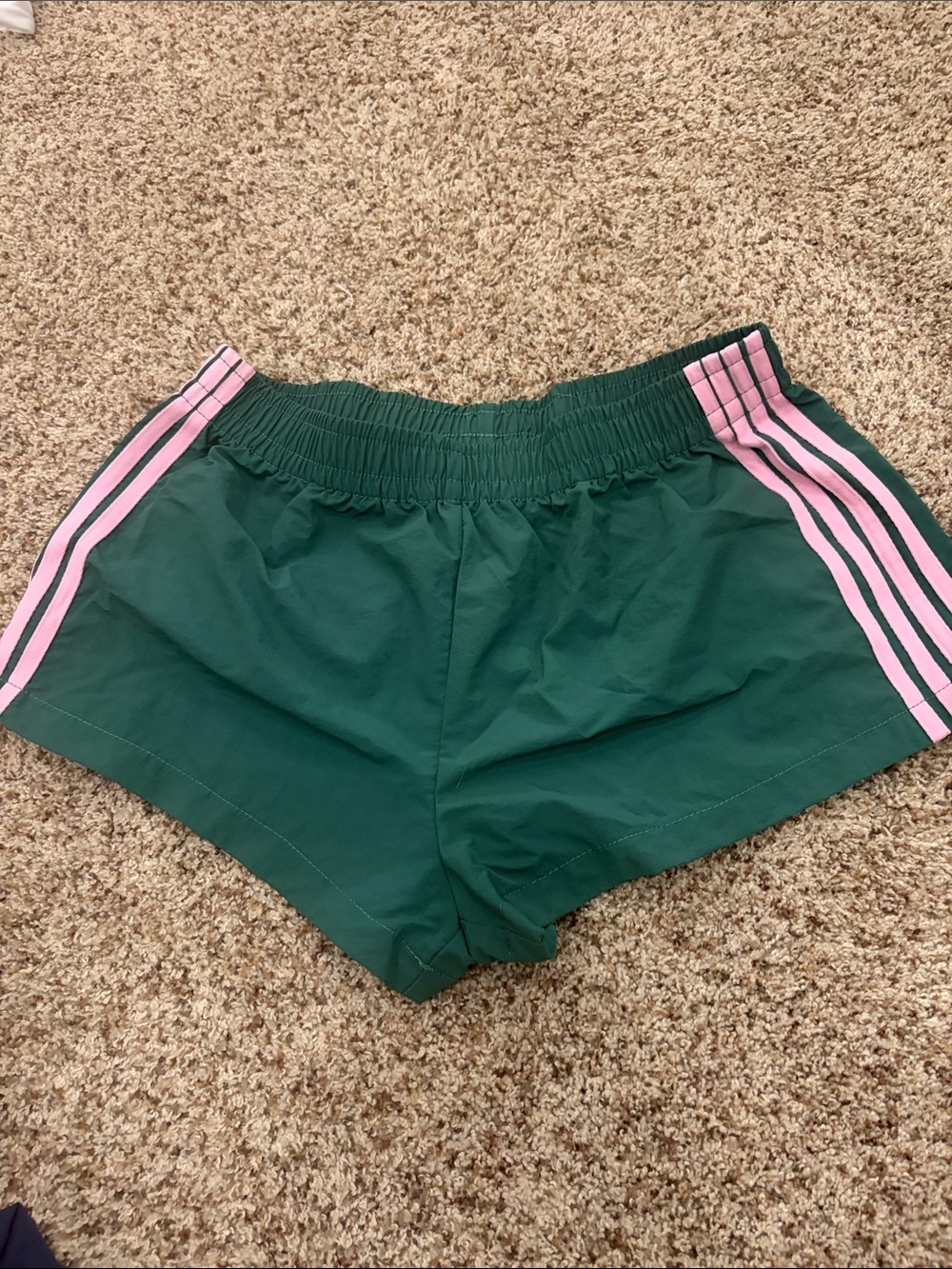 Green Athletic Shorts with Pink Stripe Detail